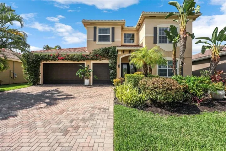 Mediterranean / spanish house with stucco siding, decorative driveway, a garage, and a tiled roof
