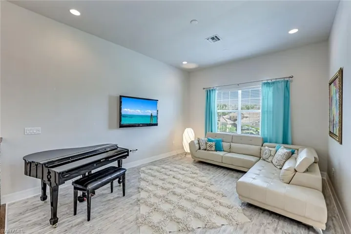 Living room featuring recessed lighting and light wood-style flooring