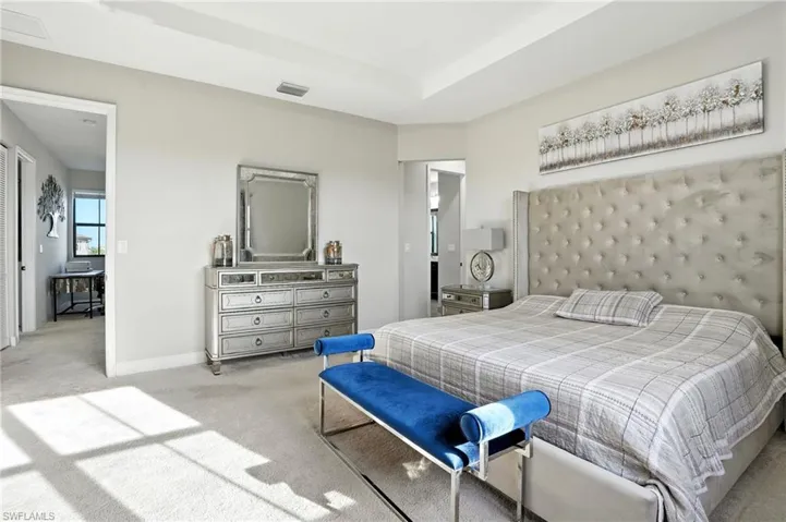 Carpeted bedroom featuring baseboards