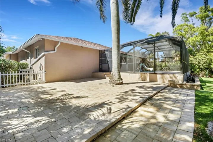 View of patio / terrace featuring a lanai and a sunroom