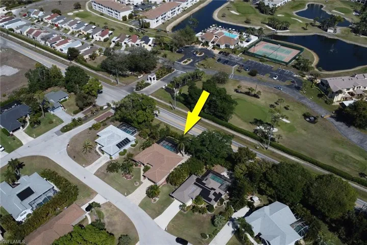 Aerial view of property's location with nearby suburban area