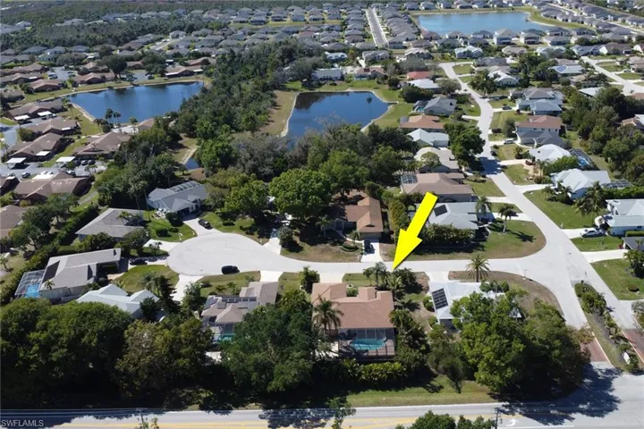 Aerial view of property's location featuring nearby suburban area