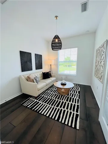 Living room featuring dark hardwood / wood-style floors