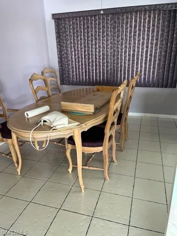 Unfurnished dining area with tile flooring