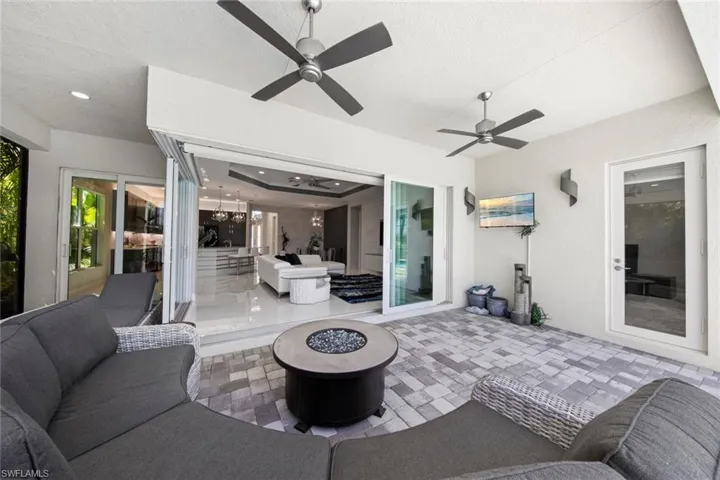 View of patio featuring an outdoor hangout area and ceiling fan