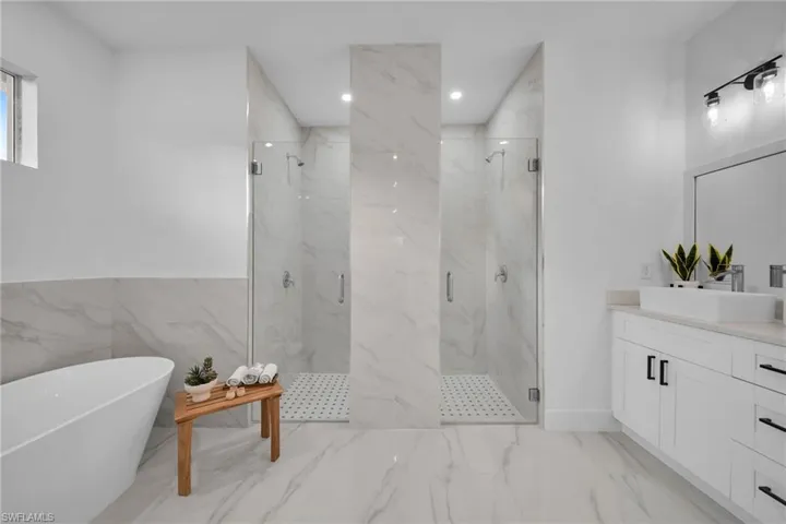 Bathroom with independent shower and bath and vanity
