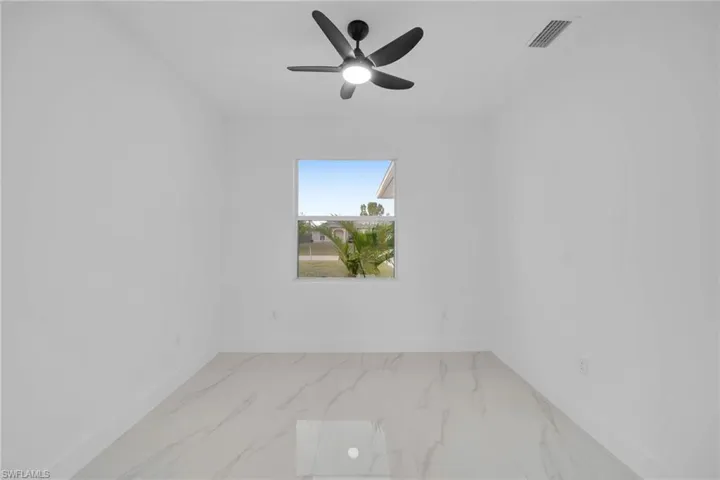 Unfurnished room with ceiling fan