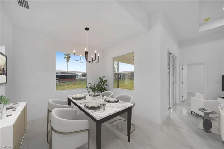 Virtually Staging Dining room with a notable chandelier