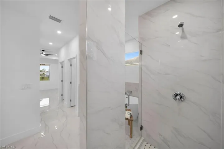 Bathroom featuring tiled shower