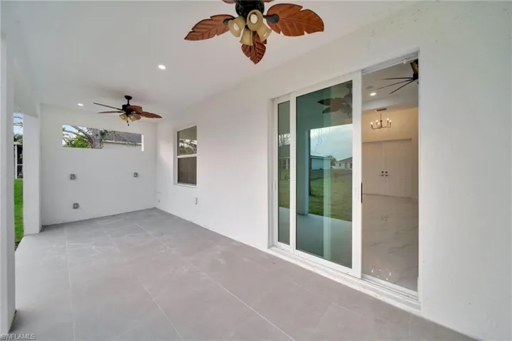 View of patio featuring ceiling fan
