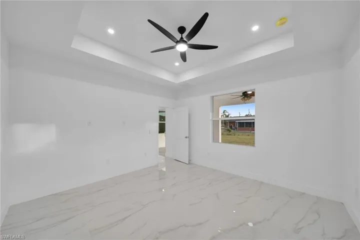 Spare room featuring a raised ceiling