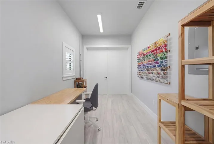 Office space with a sauna and light wood-type flooring