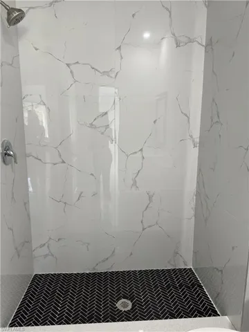 Bathroom with a tile shower