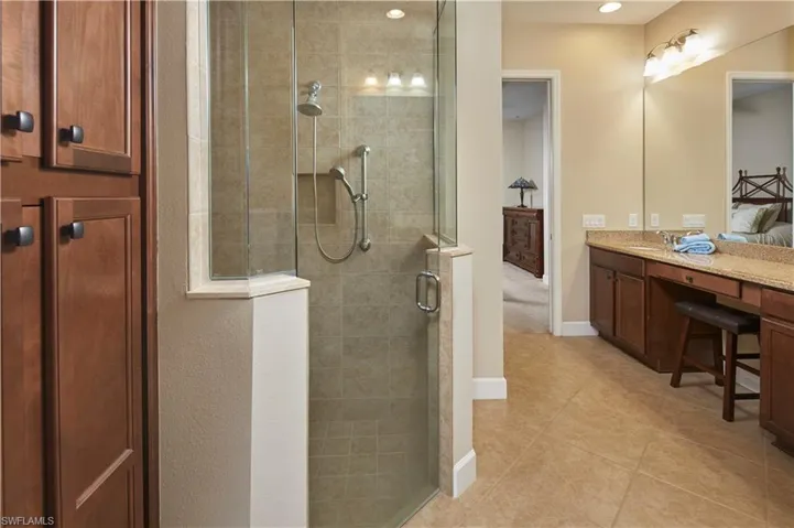 En-suite bath includes walk in shower and dual vanities - this bathroom is spacious enough for TWO!