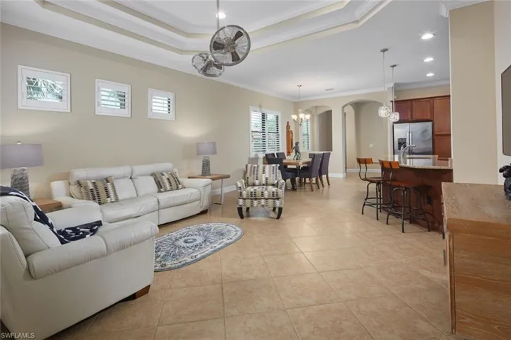 Tile on the diagonal, volume ceilings & open great room all overlooking the peaceful preserve.