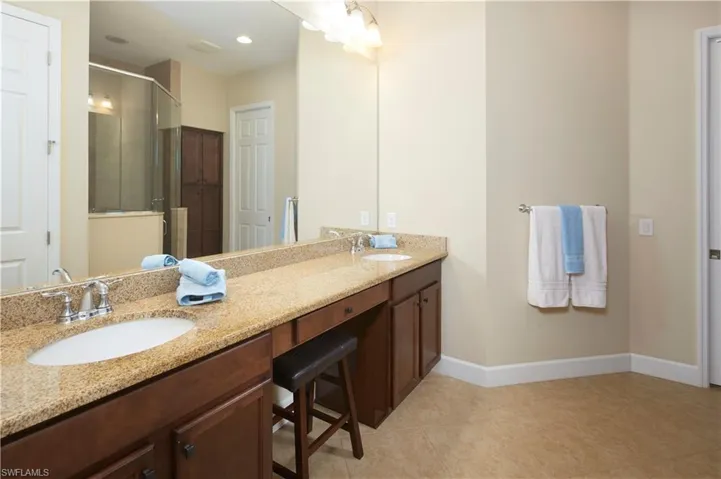 Dual sinks, vanity and so much extra cabinet space.