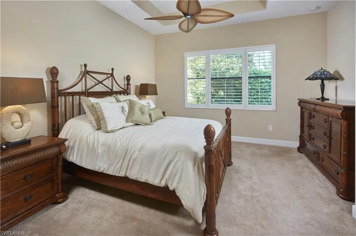 Primary bedroom with large en suite bathroom.