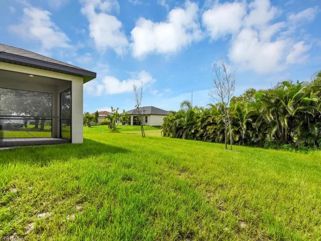 View of yard featuring a sunroom