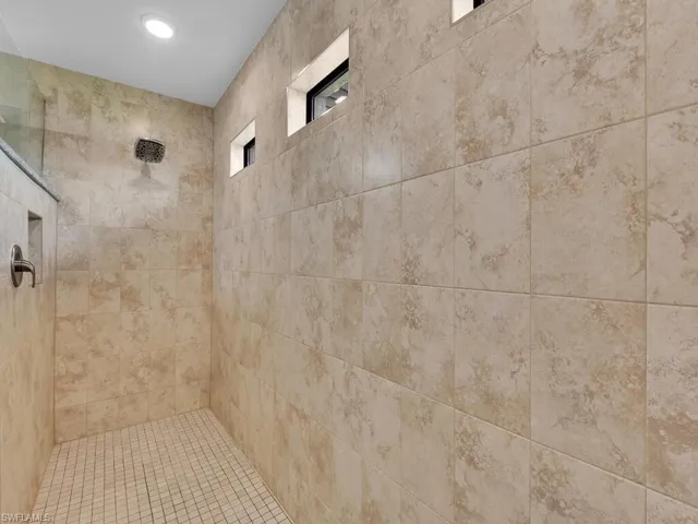 Bathroom featuring tiled shower