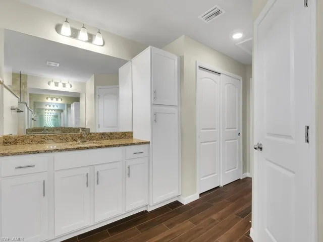 Bathroom with wood-type flooring and vanity
