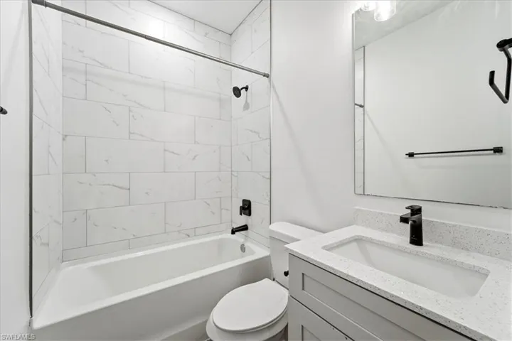 Full bathroom featuring vanity and shower / tub combination