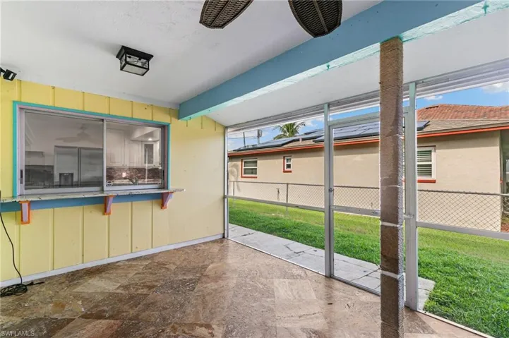 Screened Lanai with kitchen pass through sunroom