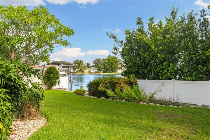 View of yard with a water view