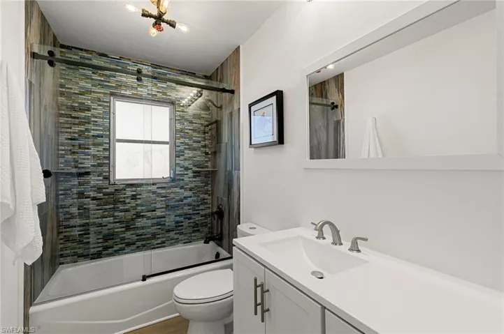 Bathroom 2 with shower tub and vanity