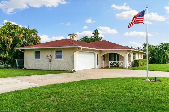 View of front with large circular driveway