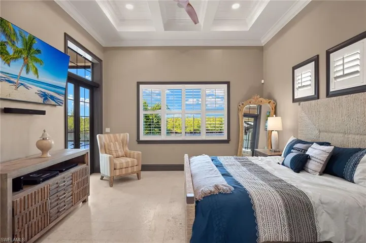 Bedroom featuring beamed ceiling, crown molding, multiple windows, and coffered ceiling