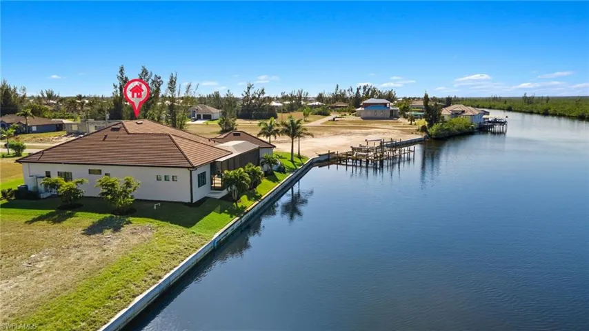 Birds eye view of this beautiful and unique home looking south down the canal.