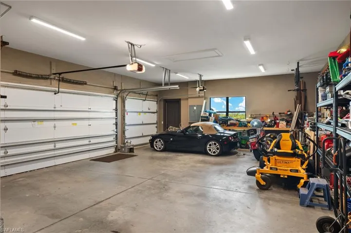 Oversized 3 car garage with 9ft and 18ft overhead garage doors.  The garage is extra deep(Just under 26 ft. deep) for plenty of storage for your vehicles, toys, tools or other items.