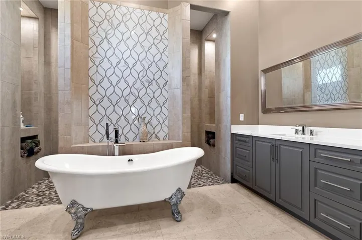 Master bathroom with Unique ClawFoot Tub and walk through shower.