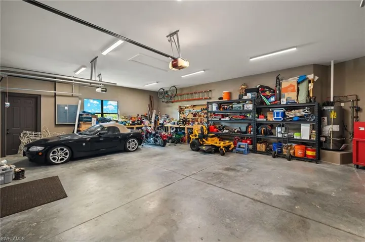 Garage with a workshop area, gas water heater. Again, plenty of space for vehicles and/or storage.  Not your standard sized garage.
