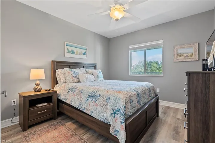 Guest Bedroom featuring light wood-type flooring and ceiling fan