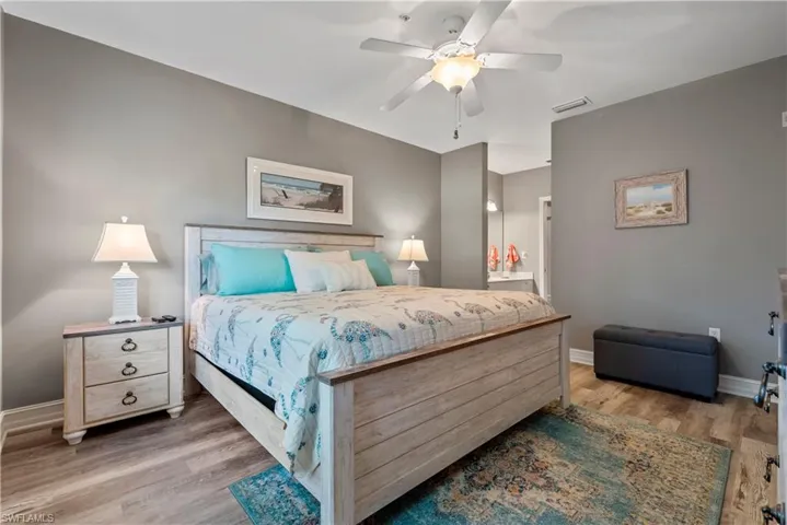 Bedroom featuring hardwood / wood-style floors and ceiling fan