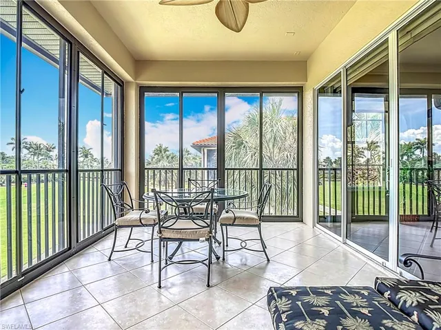 Sunroom / solarium with tile patterned flooring, healthy amount of natural light, and a textured ceiling