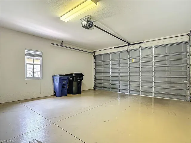 Garage featuring a garage door opener