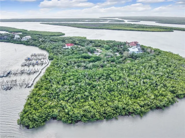 Drone / aerial view of a large body of water and numerous boat docks