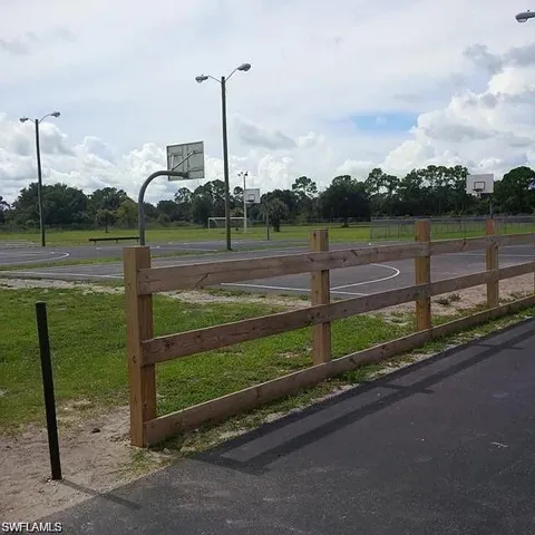View of sport court with community basketball court and a rural view
