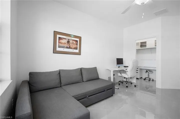 Recessed built-in desk area featuring integrated shelving