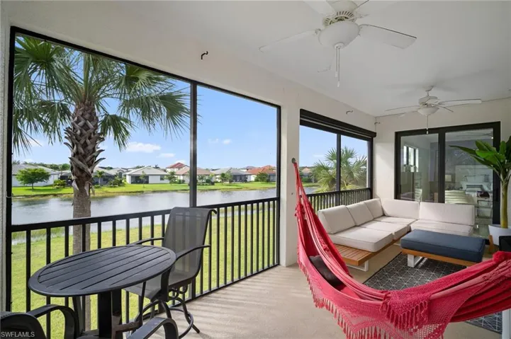 Screened lanai featuring a waterscape backdrop