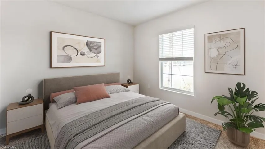 Bright room featuring white walls and a large window with white blinds