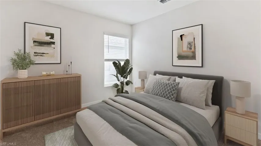 Spacious bedroom featuring light neutral wall tones, carpeted flooring, a window with blinds, and recessed lighting