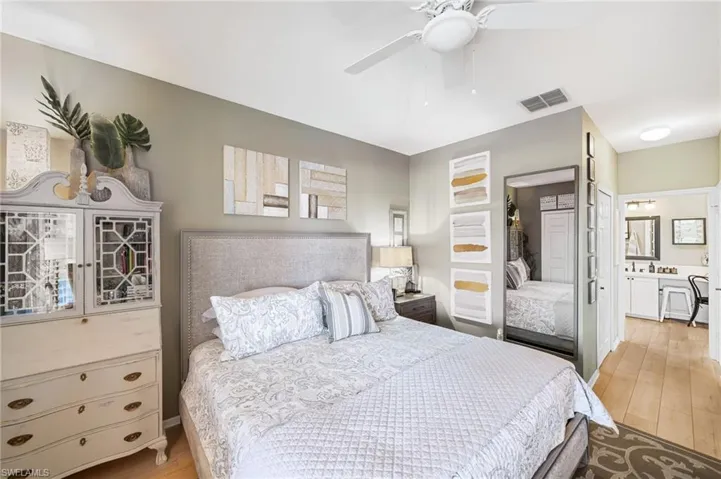 primary bedroom with his and her walk in closets and linen closet too