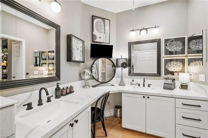 Remodeled primary bath to include private water closet, wall in tile shower double new vanities with quartz tops; all new fixtures