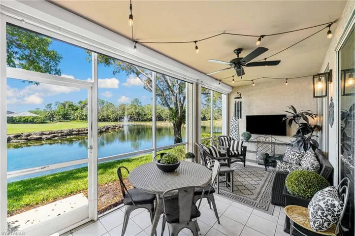 large lanai with tile floors. Sliding doors from kitchen, living room and primary bedroom