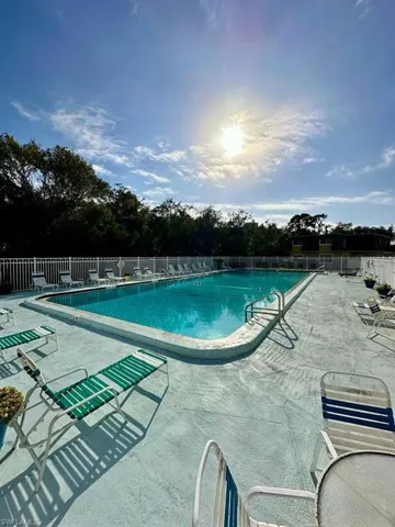 Community swimming pool with concrete surround