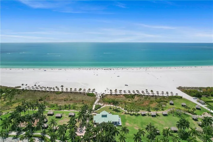 Aerial view with a water view and a beach view