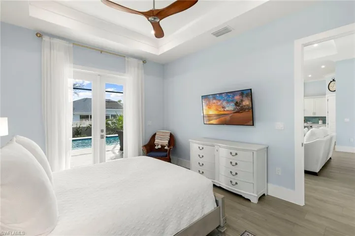 Primary bedroom with French doors to lanai
